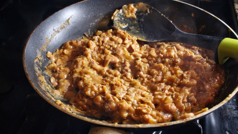 refried beans in skillet