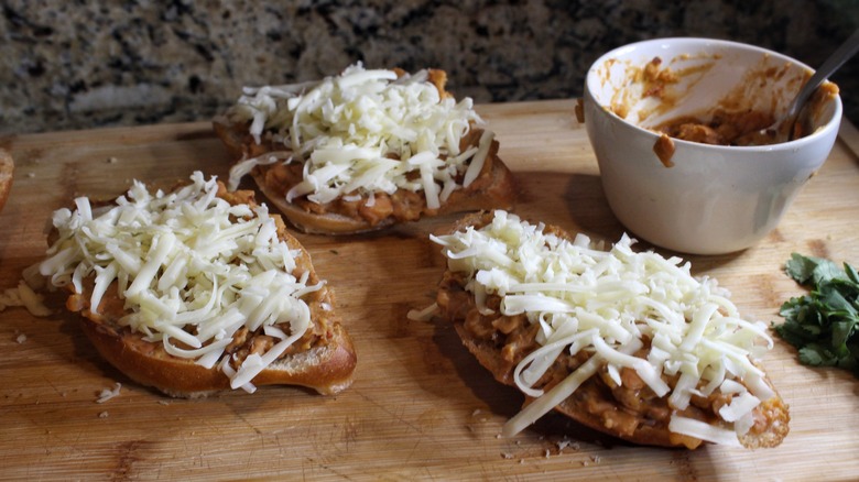 rolls with beans and shredded cheese