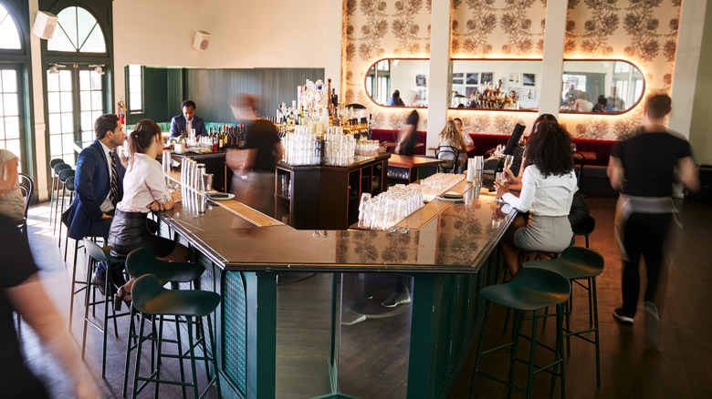 busy bar with bar stools