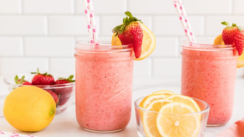 Frozen creamy strawberry cocktail in jars