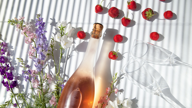Sparkling rose wine and fresh strawberries