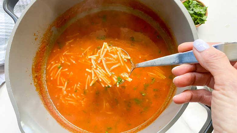 ladle full of fideo soup