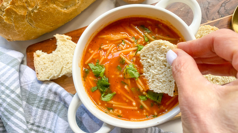 dipping bread in soup