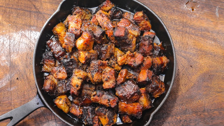 burned pork ends in cast iron skillet