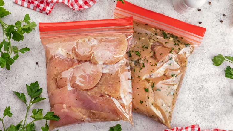 two bags of chicken pieces in brine