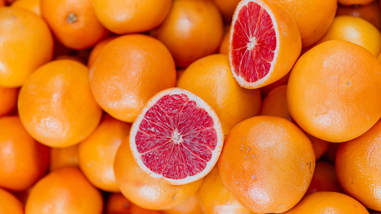 Whole and sliced grapefruits