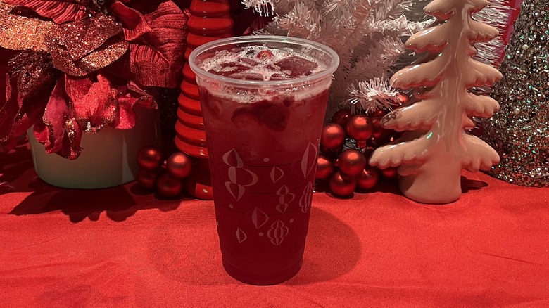 Starbucks Cran-Merry Orange Refresher with a festive background