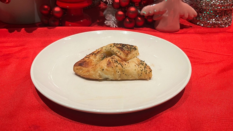 Turkey sage danish on a white plate with a festive background