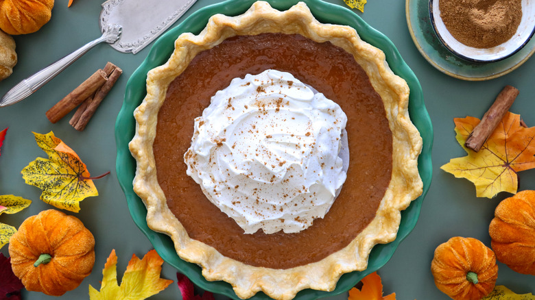 pumpkin pie with whipped cream in the center