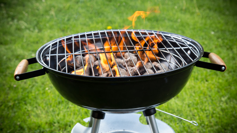 Charcoal grill with flames