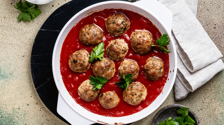 Meatballs in pan of tomato sauce