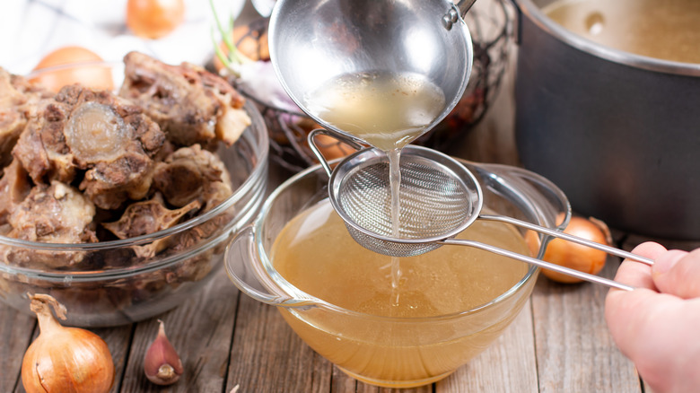 bone broth being strained