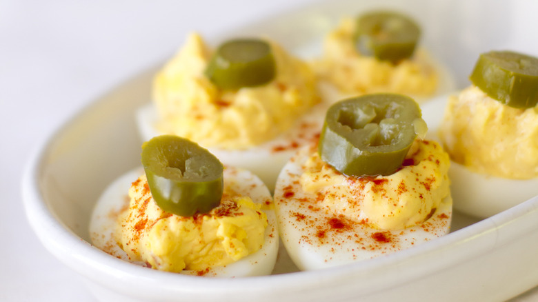 Deviled eggs with jalapeño toppings