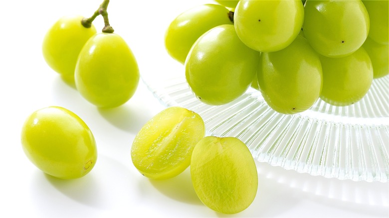 Whole and sliced green grapes