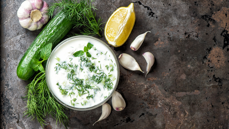 Bowl of tzatziki with ingredients