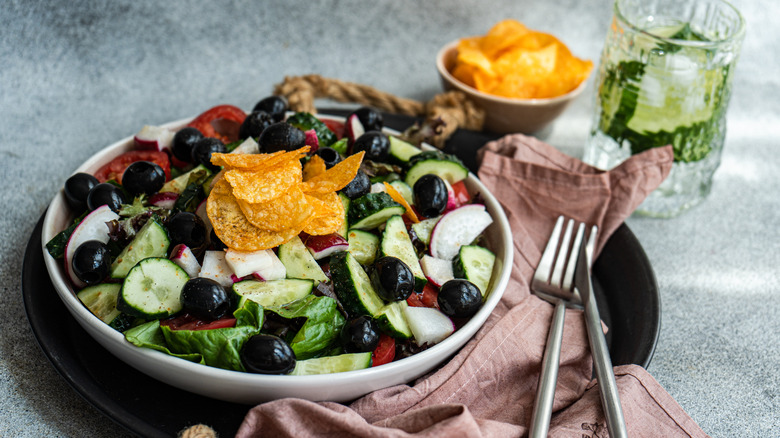 Salad topped with potato chips