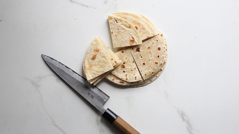 Cutting tortillas on surface
