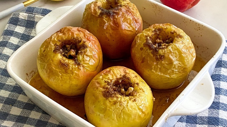 baked apples in white baking dish