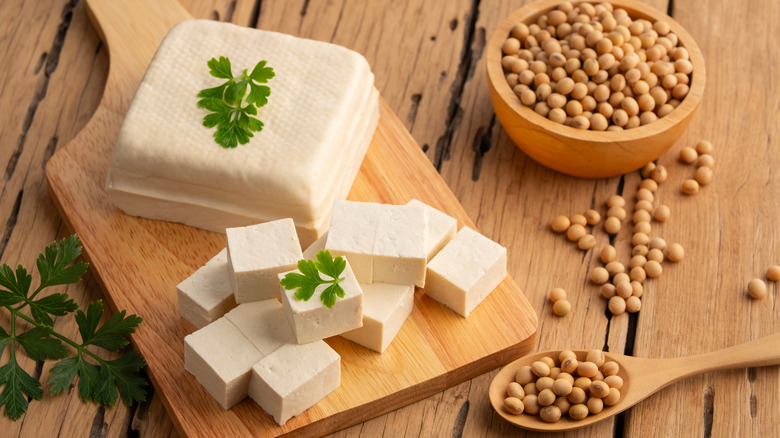 Tofu diced on a cutting block