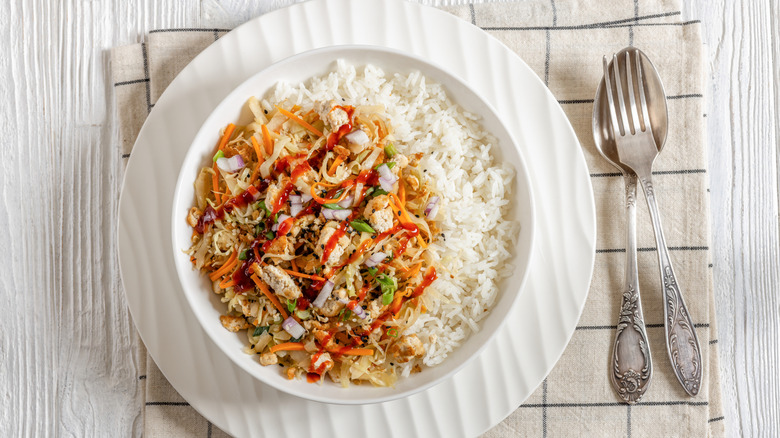 Shredded tofu on a bed of rice and vegetables