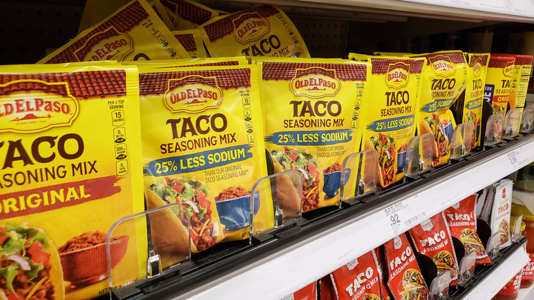 Grocery store shelf full of taco seasoning packets