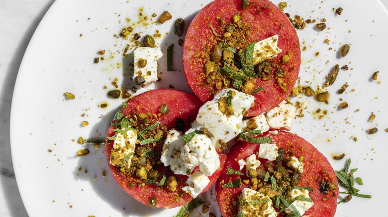 Watermelon rounds with cheese and nuts