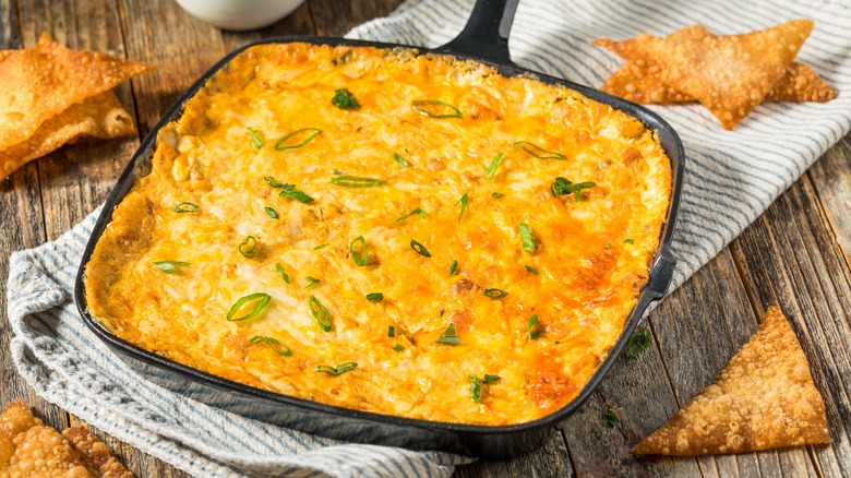 Baked crab rangoon dip with fried wontons