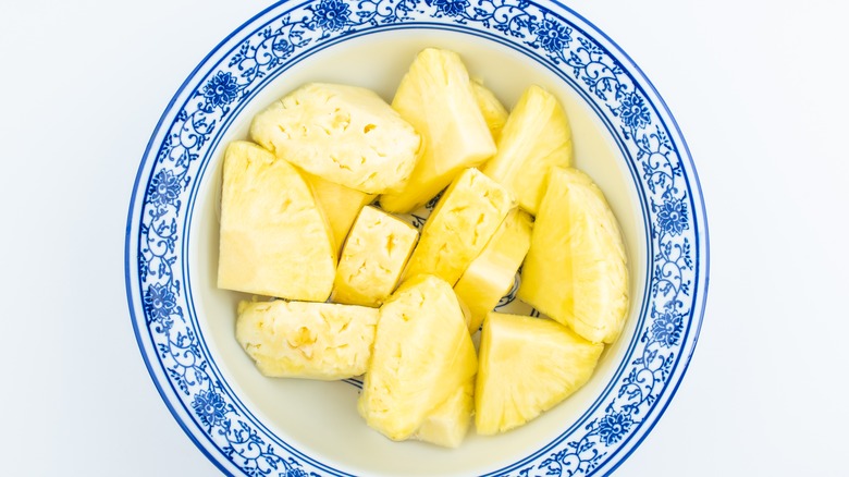 slices of pineapple soaking in salt water