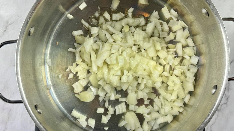 Diced onions in soup pot