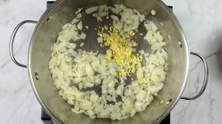 Diced onions, minced garlic, and ginger in soup pot