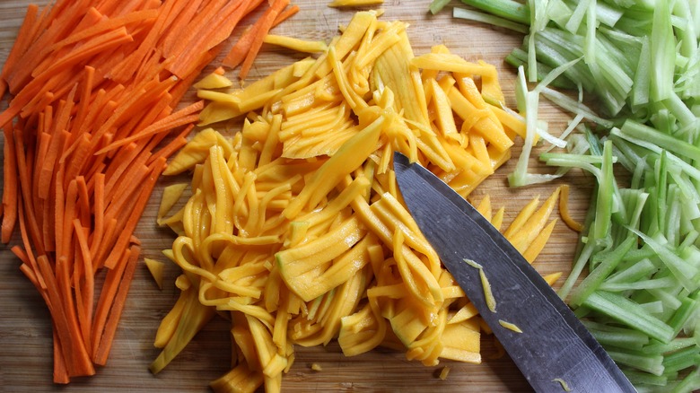 julienned vegetables with knife