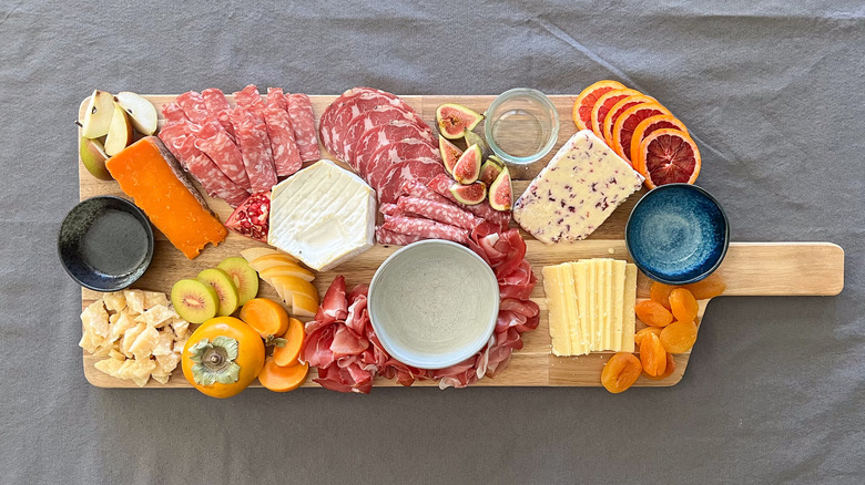 Charcuterie board with cheeses, meats, fruits