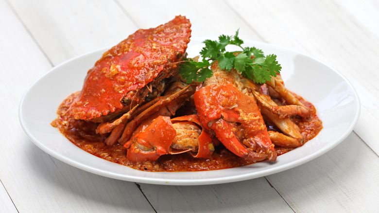 Singaporean chili crab on white platter
