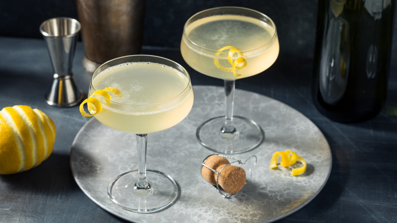 The French 75 cocktail with gin, champagne, and a lemon twist