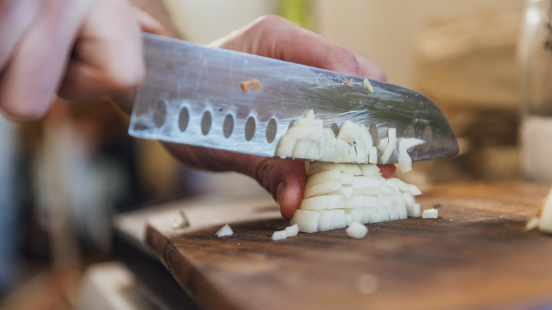 Knife slicing onions