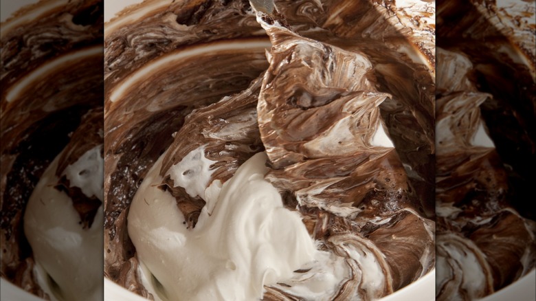Folding chocolate into whipped cream