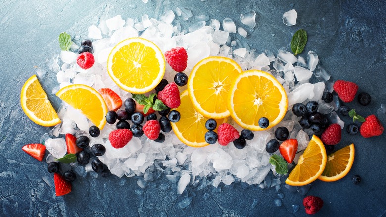 Citrus, berries, and mint leaves over ice