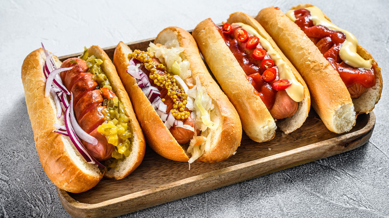 Hot dogs on tray with different toppings