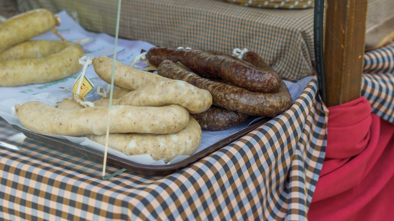 Butifarra sausages on gingham tablecloth