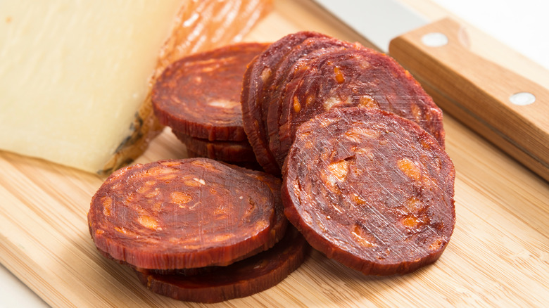 Chorizo slices and cheese wedge