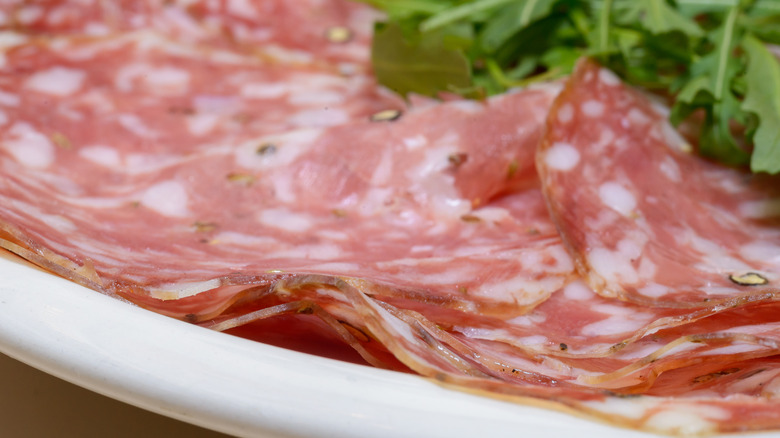 Finocchiona slices on white plate