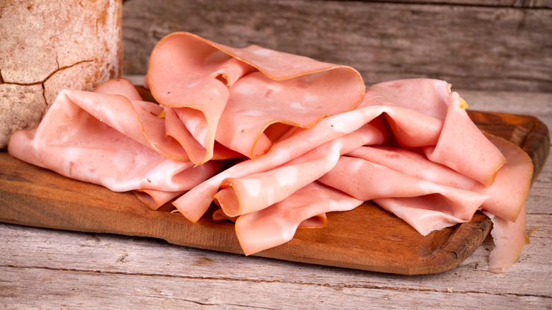 Mortadella slices on cutting board