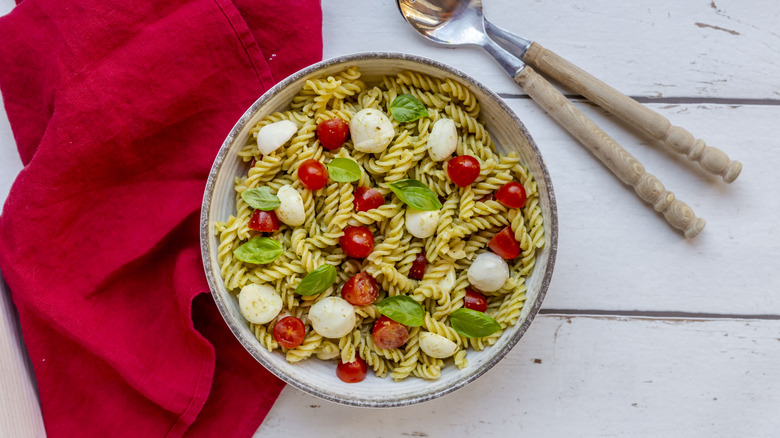 Pasta salad with mozzarella, tomatoes, and basil