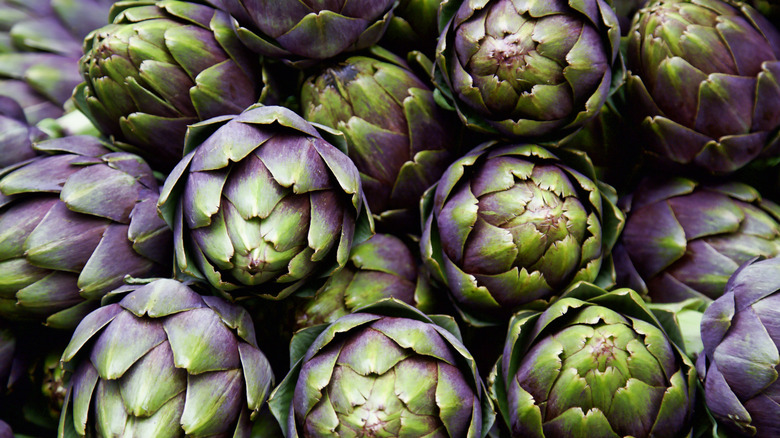 Fresh artichokes stacked on top of each other