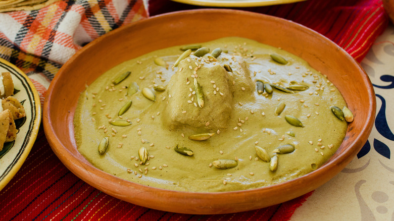 Mole verde with chicken in a terracotta bowl