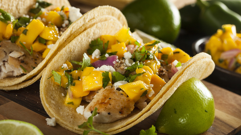 close up of fish taco with mango salsa