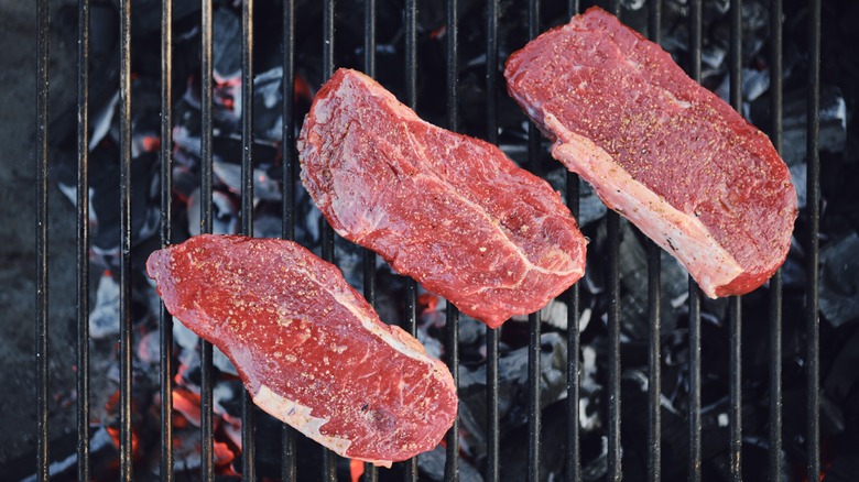 Strip steaks on the grill