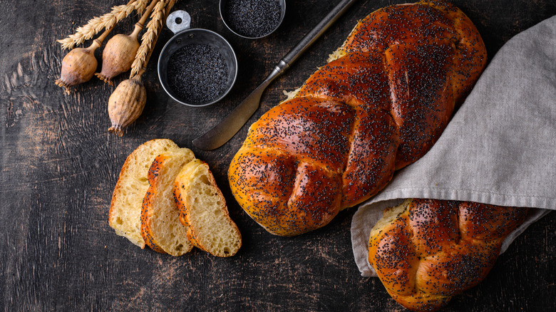 Two braided bread loaves topped with poppyseeds