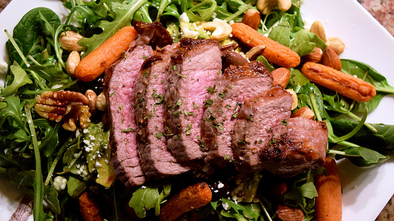 Sliced London broil with salad