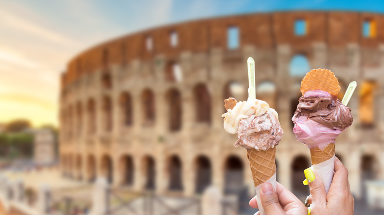 Ice cream cones held in front of the Colosseum 